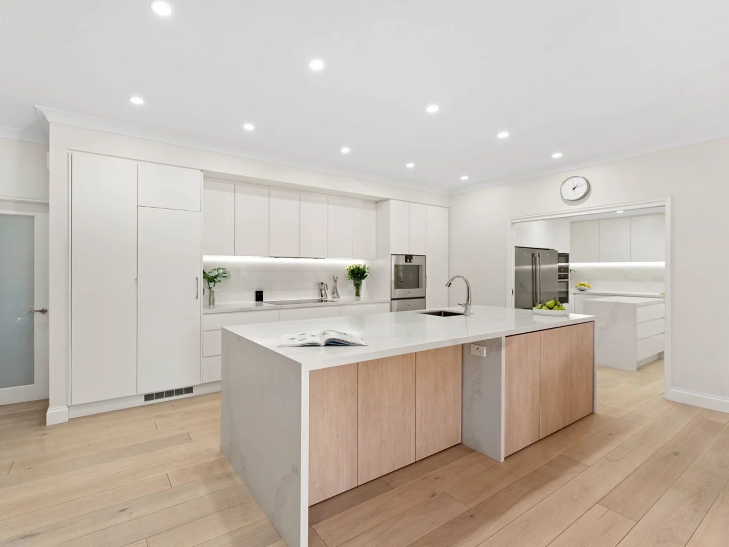 Light and airy modern kitchen featuring HW12342 Maison.